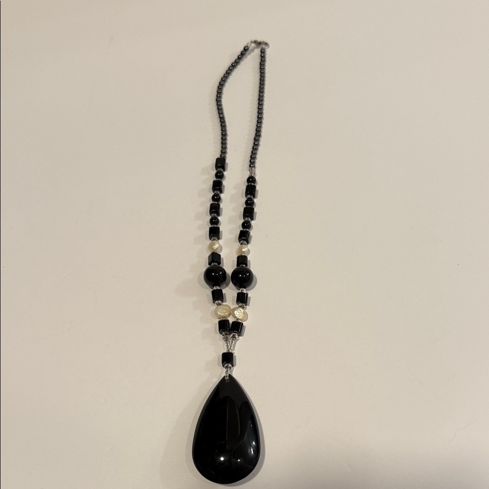 45.  Chic Black and Silver Teardrop Necklace.